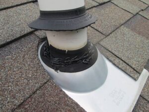 Slide the Newly Trimmed and Well-Fitted New Plumbing Roof Boot Down the Pipe Vent Shaft to Mold with the Cement Tar